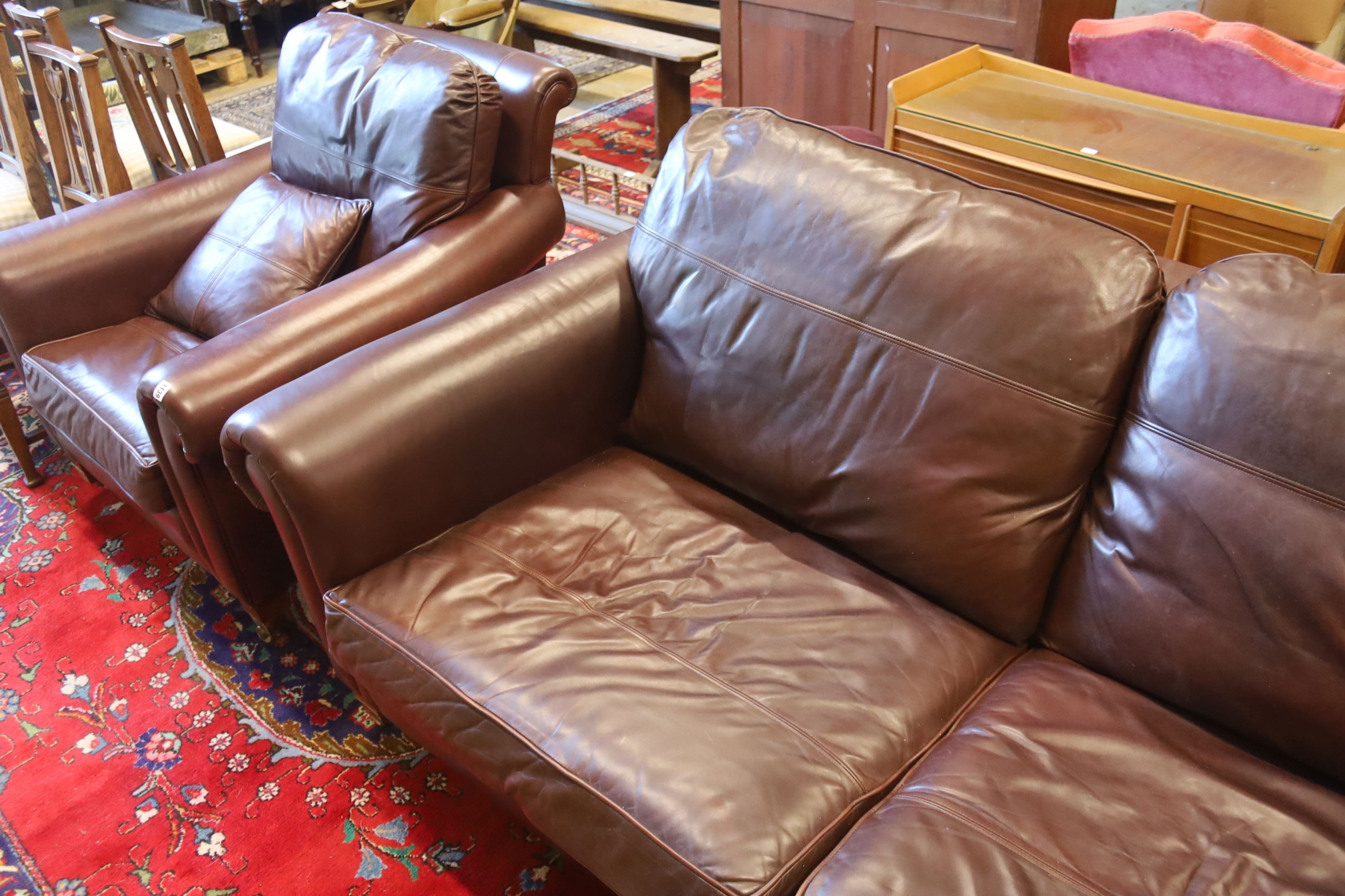 A Duresta brown leather settee and matching armchair, settee length 210cm, depth 102cm, height 90cm